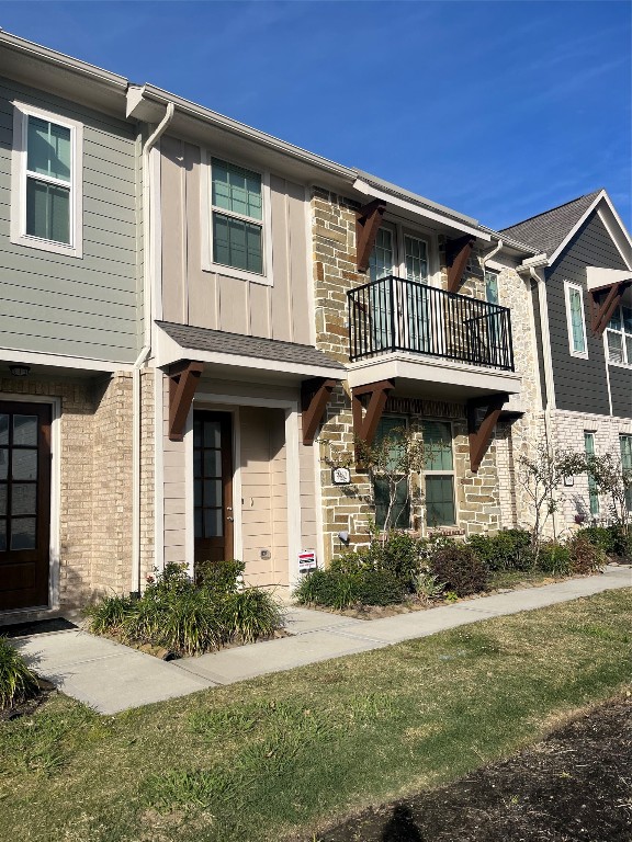 9452 Caddo Ridge Lane Cypress, TX 77433 - Photo 3 of 35 a front view of a house with a yard