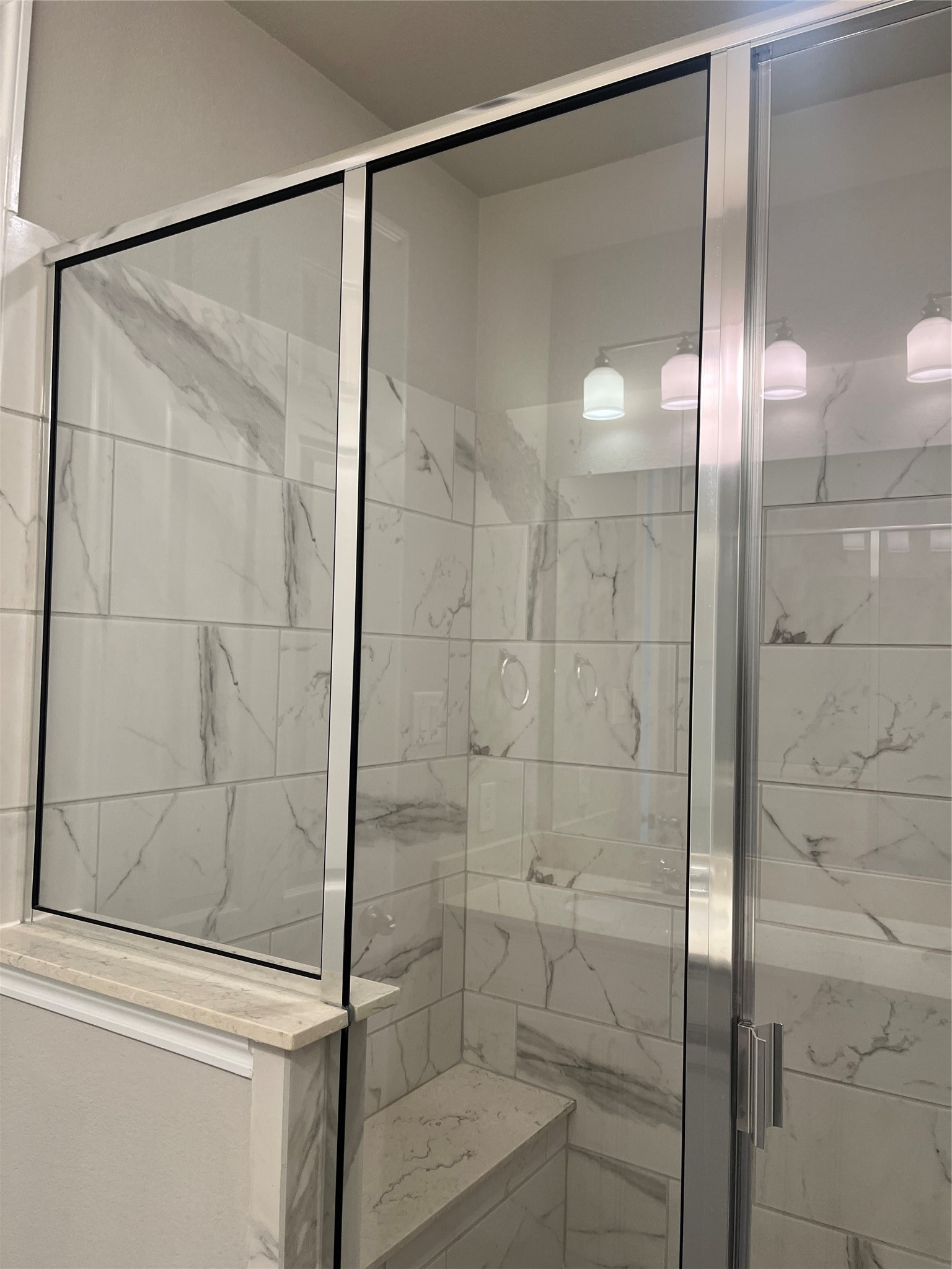 9452 Caddo Ridge Lane Cypress, TX 77433 - Photo 31 of 35 a bathroom that has a glass shower door