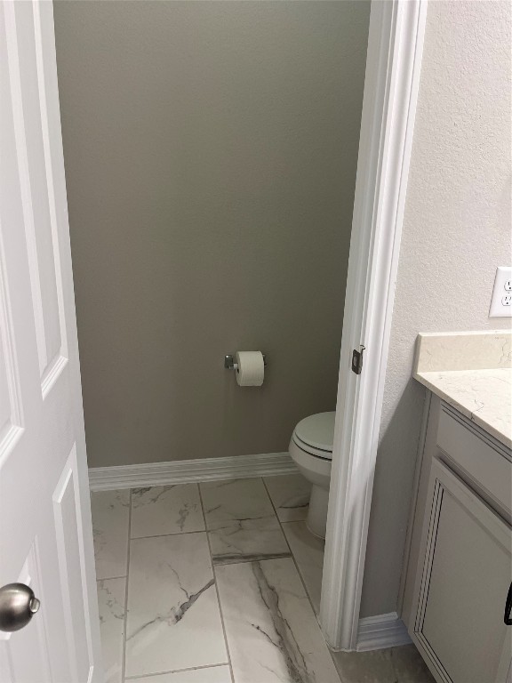 9452 Caddo Ridge Lane Cypress, TX 77433 - Photo 32 of 35 a bathroom with a sink and toilet