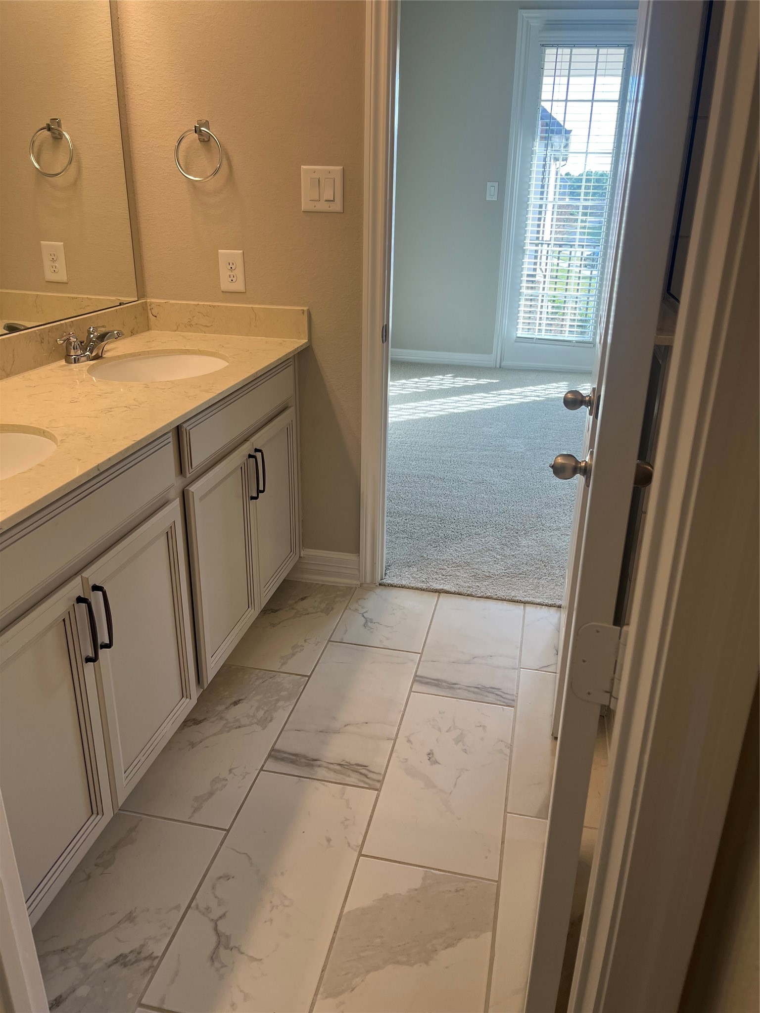9452 Caddo Ridge Lane Cypress, TX 77433 - Photo 33 of 35 a bathroom with a granite countertop sink a toilet and a mirror