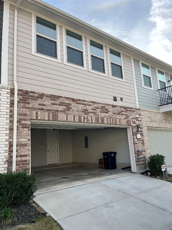 9452 Caddo Ridge Lane Cypress, TX 77433 - Photo 34 of 35 a front view of a house with garage