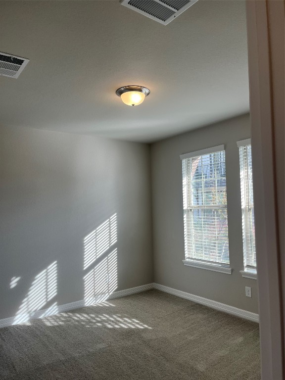 9452 Caddo Ridge Lane Cypress, TX 77433 - Photo 7 of 35 an empty room with windows