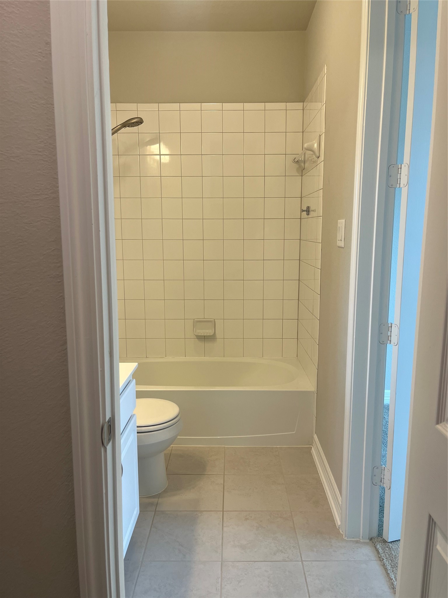 9452 Caddo Ridge Lane Cypress, TX 77433 - Photo 9 of 35 a bathroom with a bathtub and a toilet
