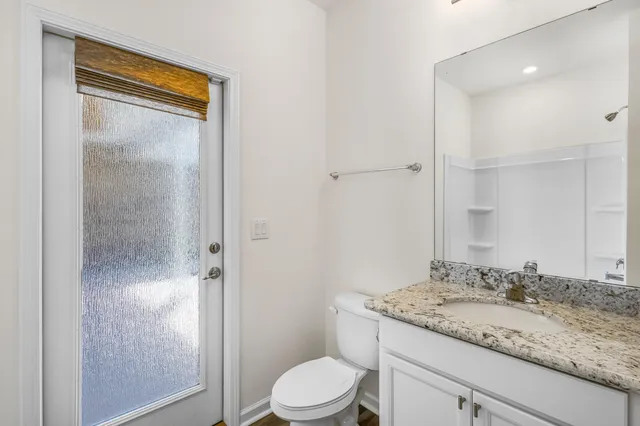 a view of a brick house with potted plants