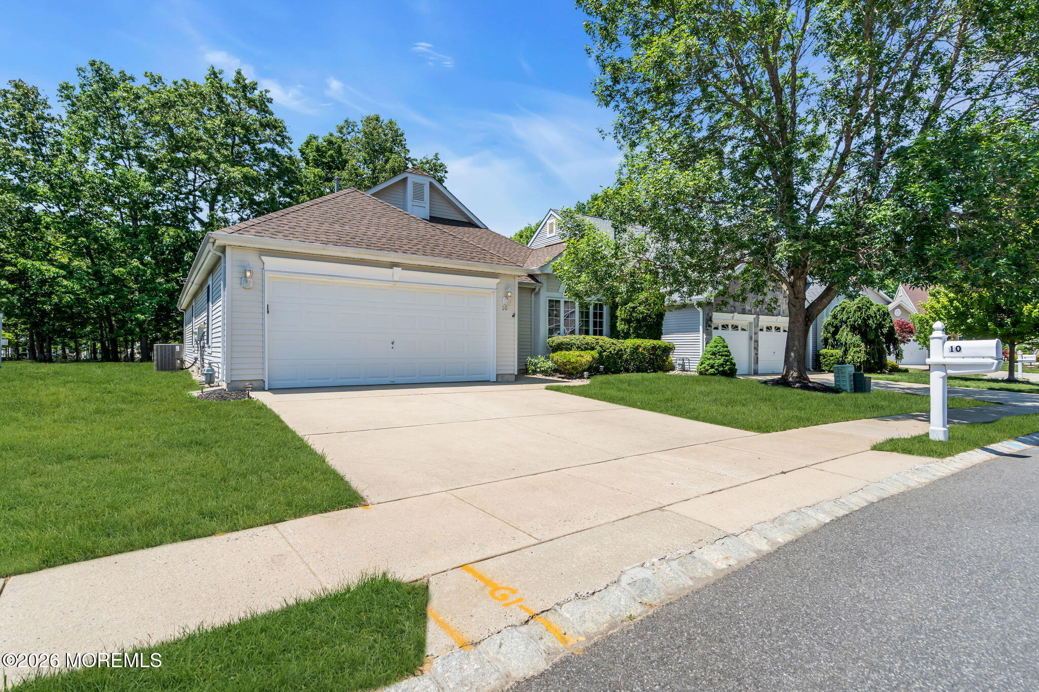 10 Congressional Road Jackson, NJ 08527 - Photo 70 of 72 a front view of a house with a yard and garage