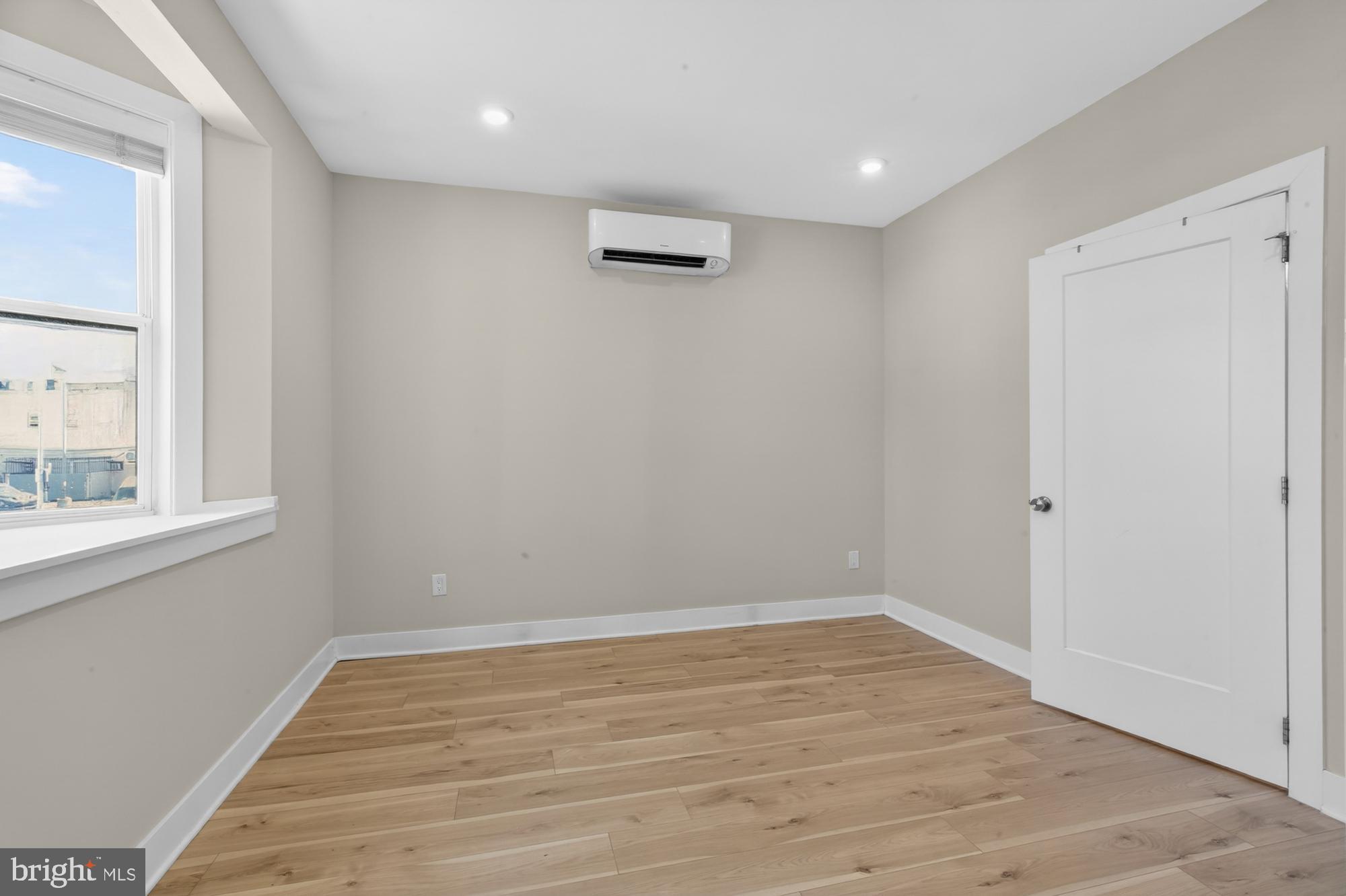 5230 Walnut Street, Unit 2F Philadelphia, PA 19139 - Photo 13 of 21 a view of empty room with wooden floor and fan