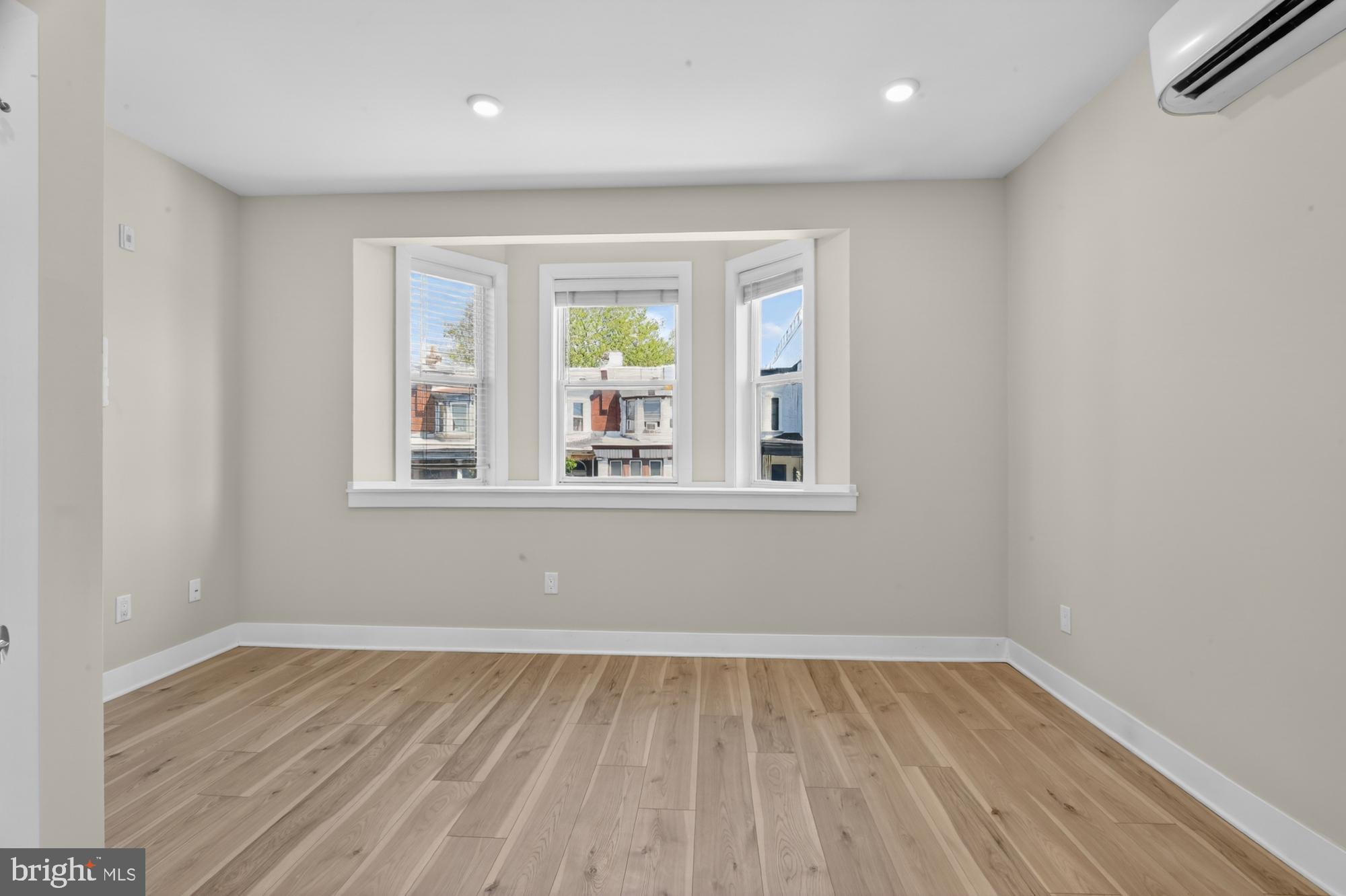 5230 Walnut Street, Unit 2F Philadelphia, PA 19139 - Photo 16 of 21 a view of empty room with wooden floor and fan