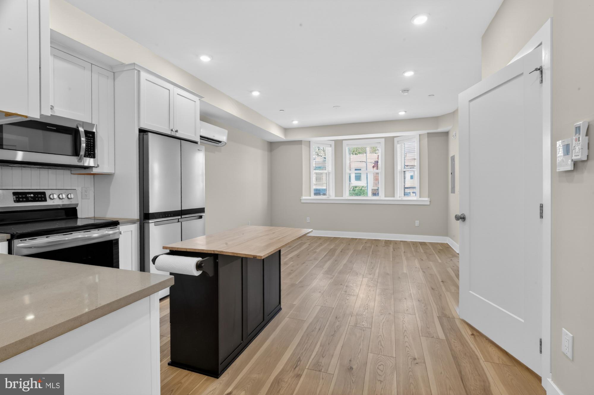 5230 Walnut Street, Unit 2F Philadelphia, PA 19139 - Photo 2 of 21 a kitchen with a sink a refrigerator and window