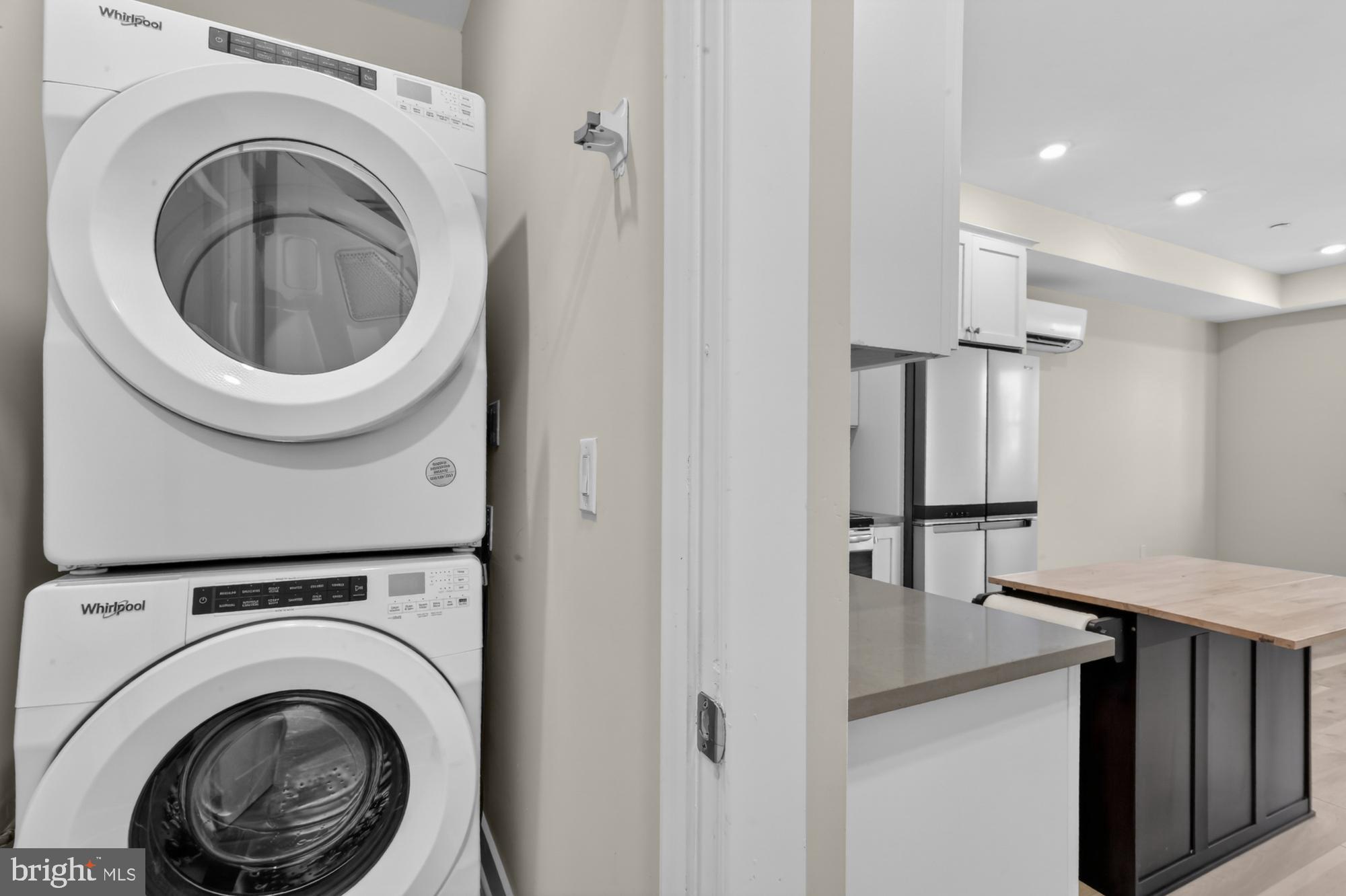 5230 Walnut Street, Unit 2F Philadelphia, PA 19139 - Photo 4 of 21 a view of a hallway with washer and dryer