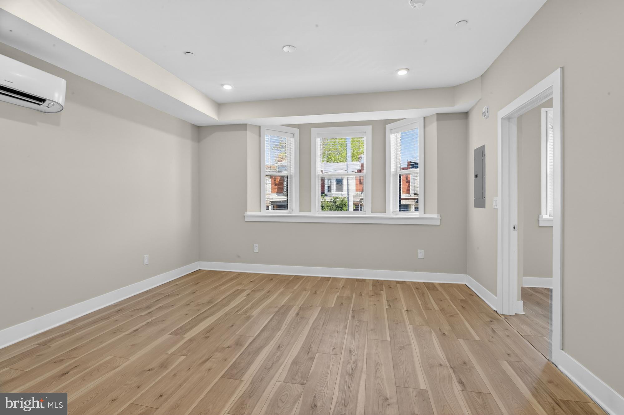 5230 Walnut Street, Unit 2F Philadelphia, PA 19139 - Photo 5 of 21 a view of empty room with wooden floor and fan