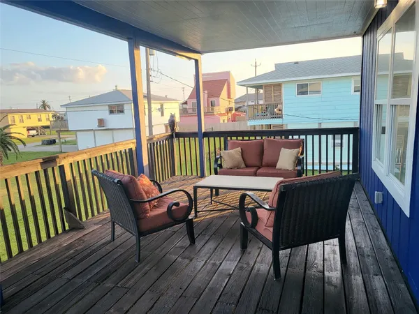 a view of a two chairs in the balcony
