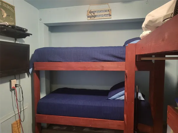 a bedroom with a bunk bed