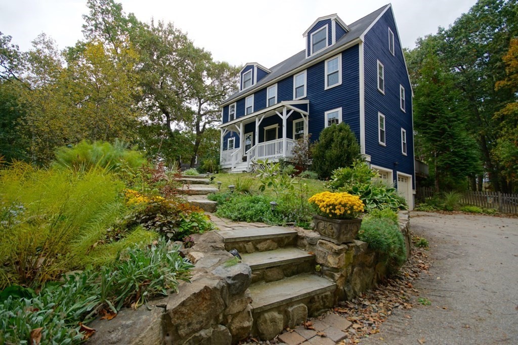 56 Boston Road Newbury, MA 01951 - Photo 1 of 31 a front view of a house with a yard and lake view
