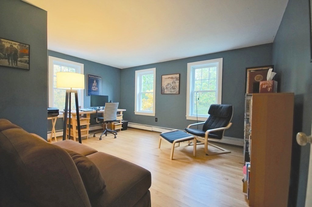 56 Boston Road Newbury, MA 01951 - Photo 23 of 31 a living room with furniture and a window