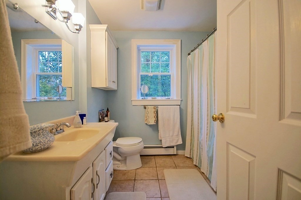 56 Boston Road Newbury, MA 01951 - Photo 25 of 31 a bathroom with a sink toilet and shower