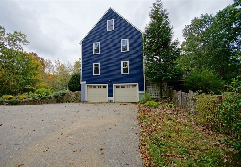 56 Boston Road Newbury, MA 01951 - Photo 30 of 31 a brick building that has a lots of trees in it