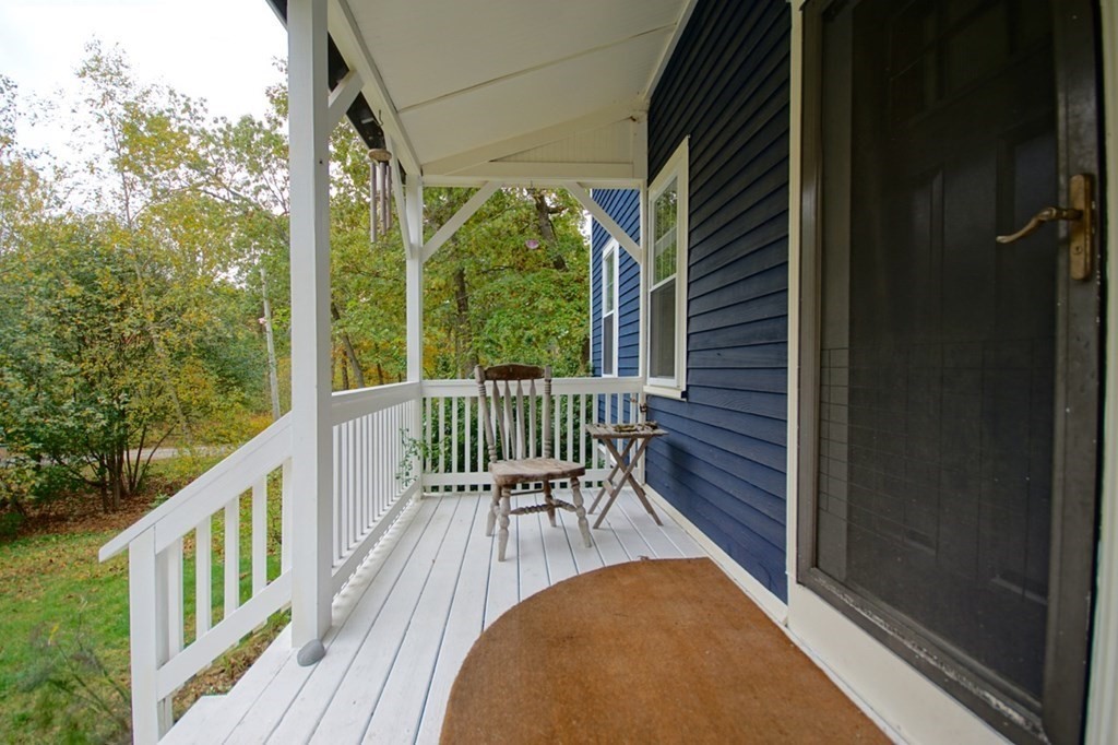 56 Boston Road Newbury, MA 01951 - Photo 4 of 31 a view of a two chairs in the balcony