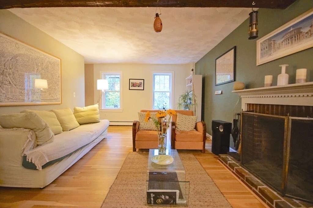56 Boston Road Newbury, MA 01951 - Photo 6 of 31 a living room with furniture and a fireplace