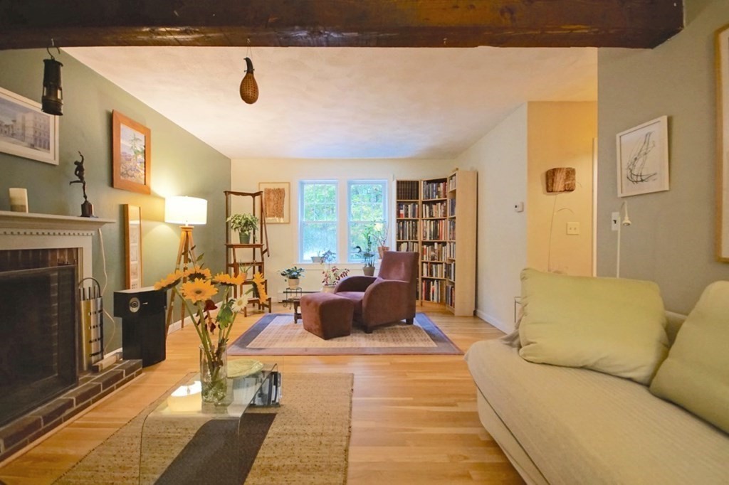 56 Boston Road Newbury, MA 01951 - Photo 8 of 31 a living room with furniture a fireplace and a large window