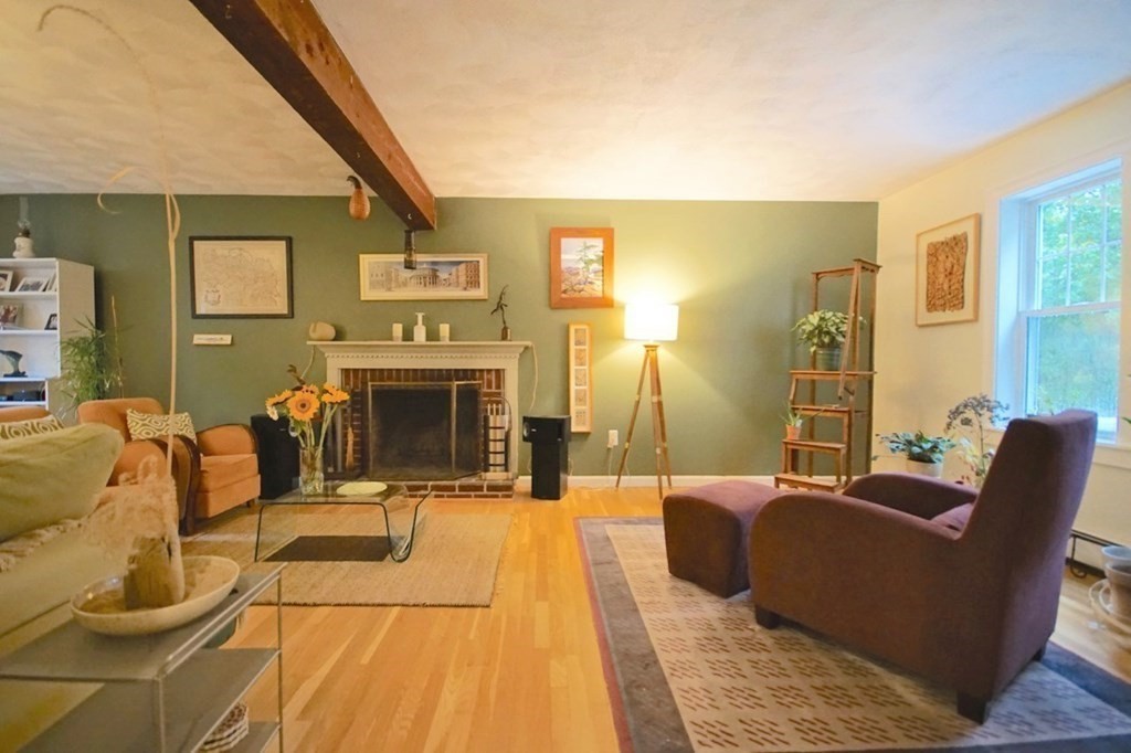 56 Boston Road Newbury, MA 01951 - Photo 9 of 31 a living room with furniture a flat screen tv and a fireplace