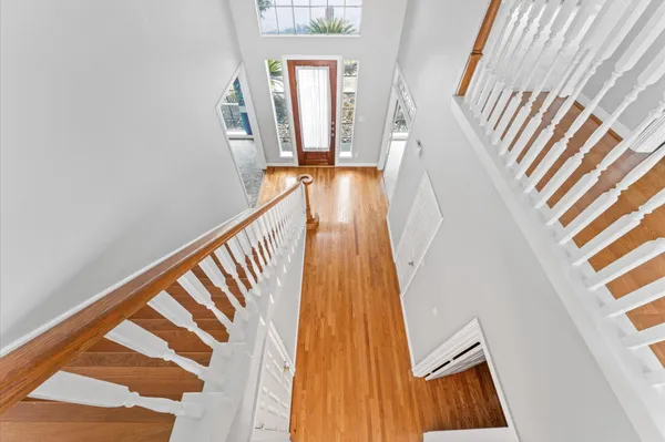 a view of stairs and wooden floor