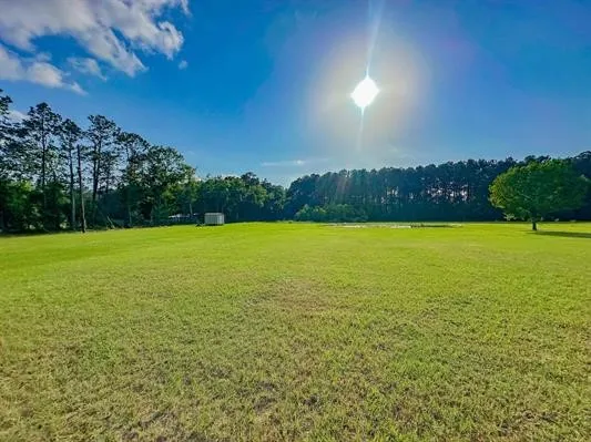 a view of a lake with a big yard