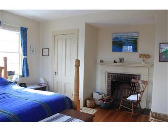 45 Links Road Gloucester, MA 01930 - Photo 12 of 17 a bedroom with a bed and a fireplace