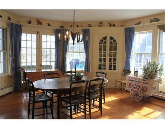 45 Links Road Gloucester, MA 01930 - Photo 5 of 17 a view of a dining room with furniture and chandelier