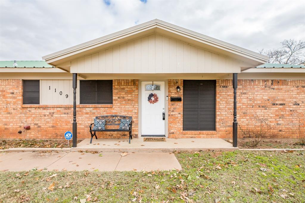 1109 Ruby Road Burkburnett, TX 76354 - Photo 1 of 1 View of front of home featuring brick siding and metal roof