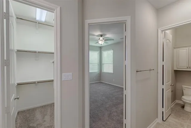 a bathroom with a light fixture and a mirror