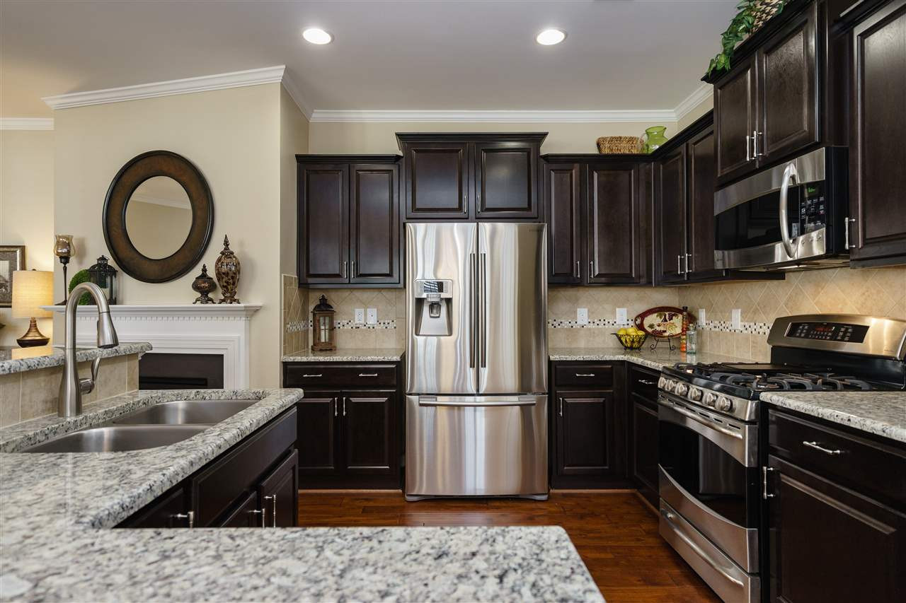 1533 Fullerton Place Raleigh, NC 27607 - Photo 9 of 25 BEAUTIFUL KITCHEN INCLUDES HARDWOODS, SS APPLIANCES, GRANITE COUNTERTOPS, AND ISLAND/BAR AREA. KITCHEN