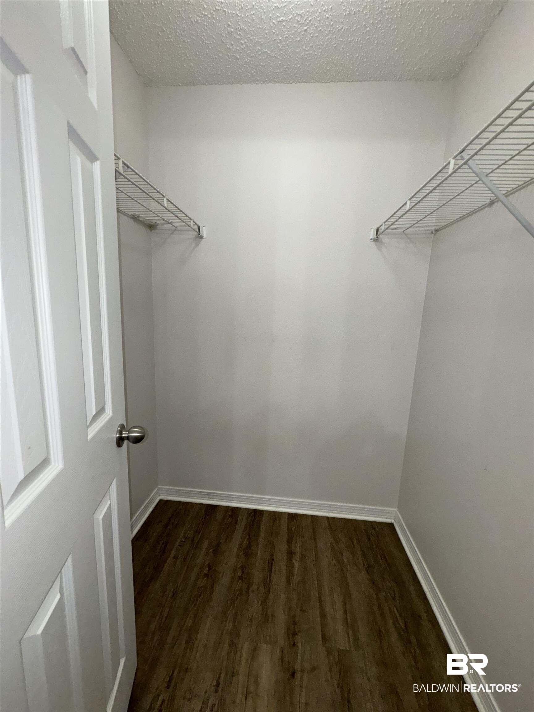 70 Plum Street Uriah, AL 36480 - Photo 15 of 36 Spacious closet with dark hardwood / wood-style flooring