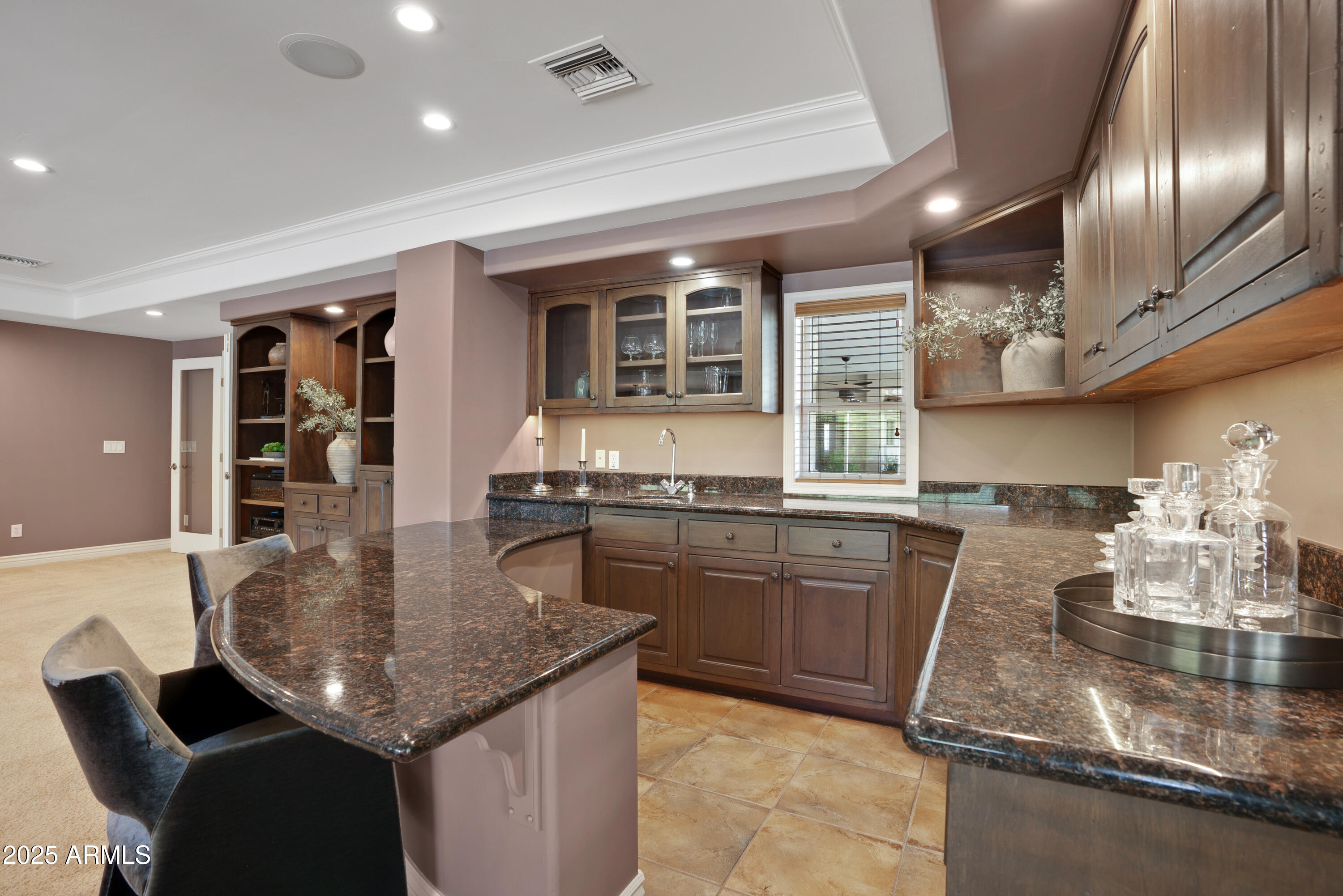 9236 North 52nd Place Paradise Valley, AZ 85253 - Photo 12 of 56 a kitchen with granite countertop kitchen island stainless steel appliances a sink stove and table