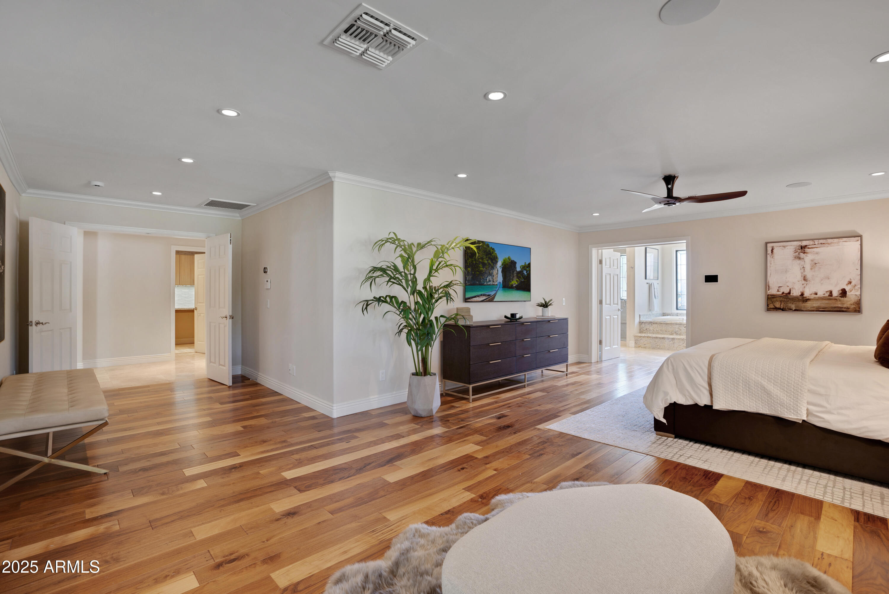 9236 North 52nd Place Paradise Valley, AZ 85253 - Photo 16 of 56 a bedroom with furniture and a wooden floor