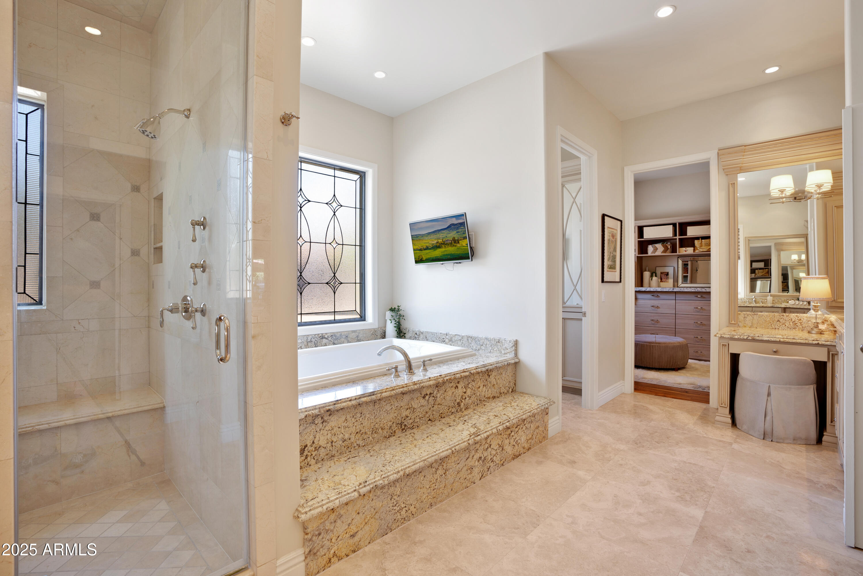 9236 North 52nd Place Paradise Valley, AZ 85253 - Photo 21 of 56 a spacious bathroom with a granite countertop sink mirror and shower