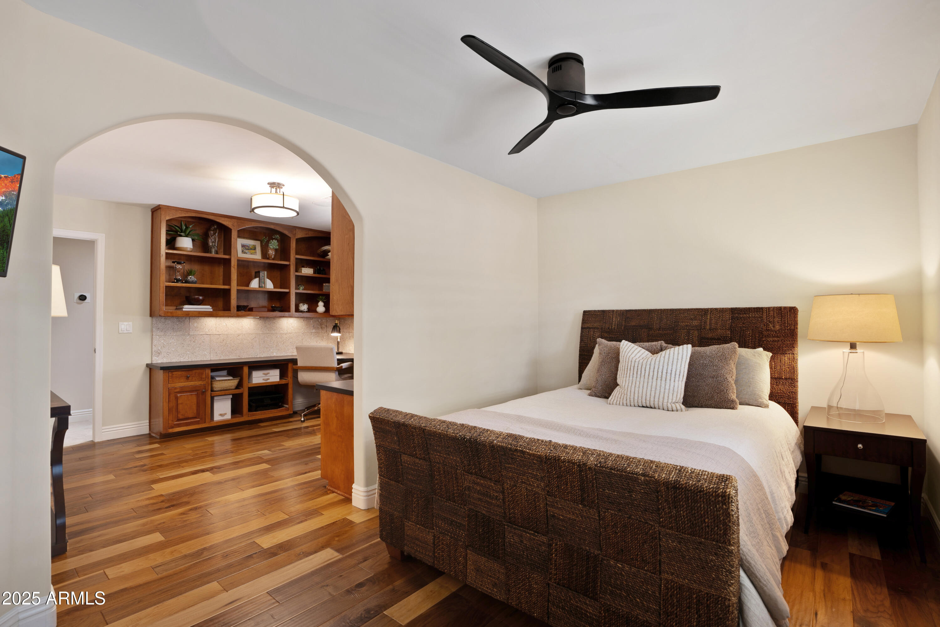 9236 North 52nd Place Paradise Valley, AZ 85253 - Photo 30 of 56 a bedroom with bed and wooden floor