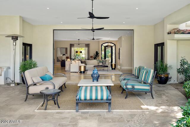 9236 North 52nd Place Paradise Valley, AZ 85253 - Photo 3 of 56 a living room with furniture a rug and a chandelier