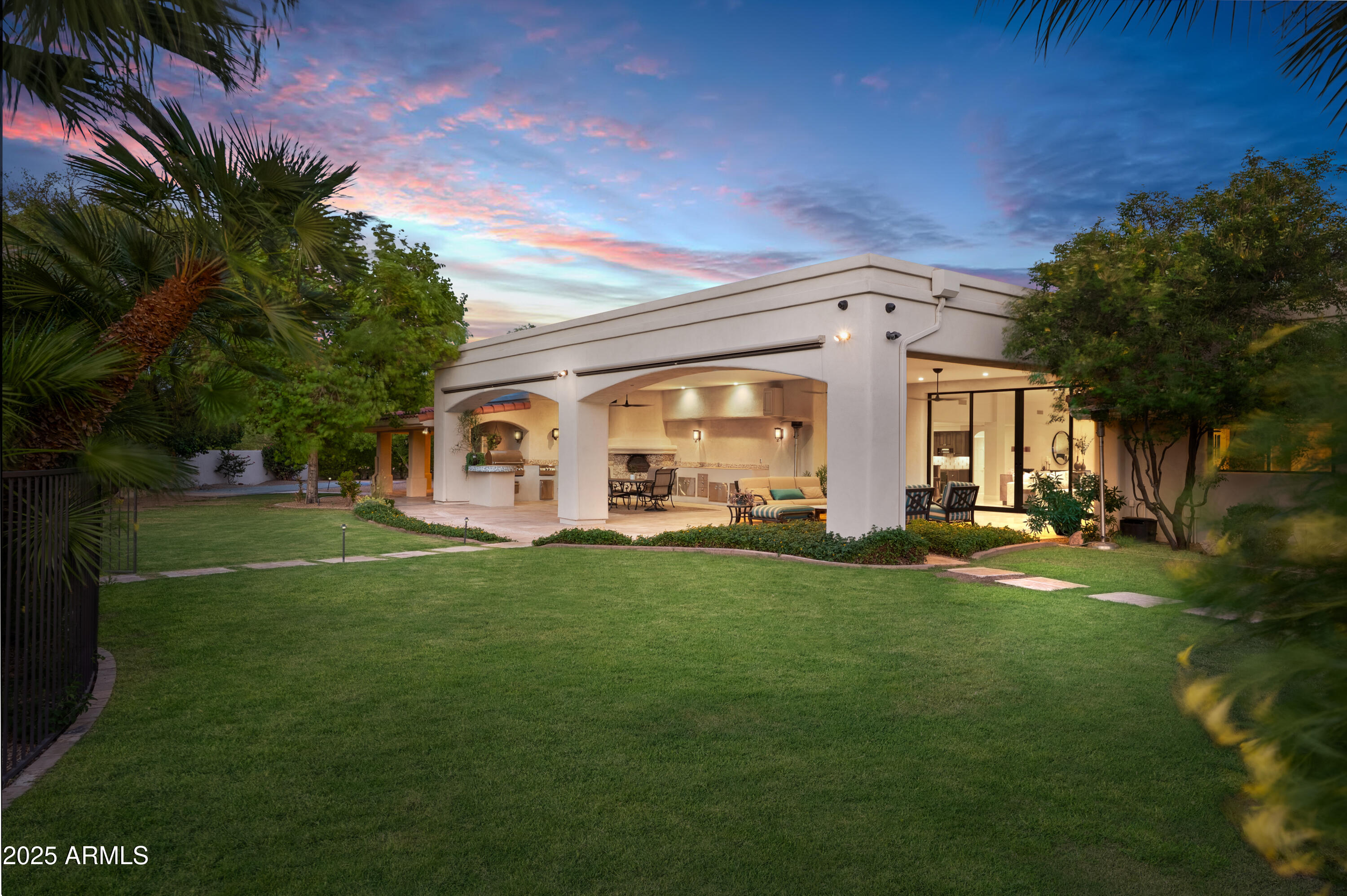 9236 North 52nd Place Paradise Valley, AZ 85253 - Photo 46 of 56 a front view of a house with a garden