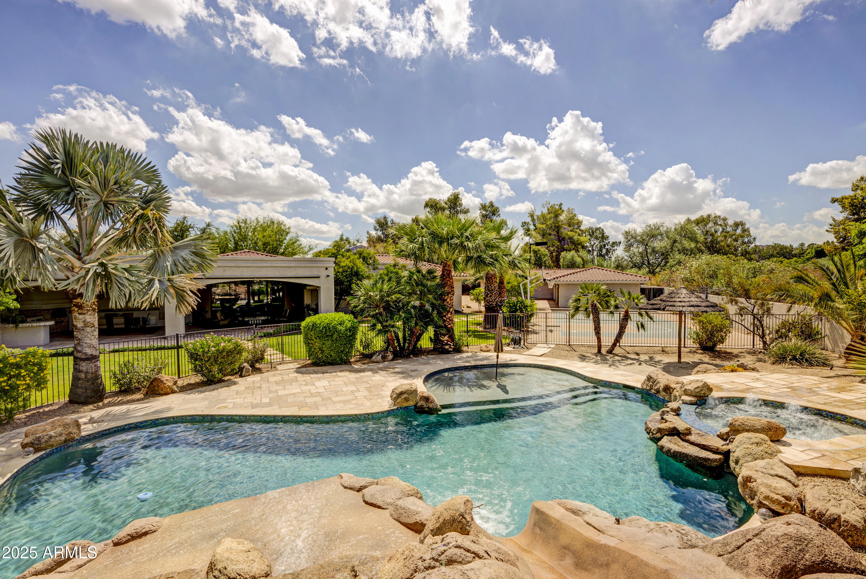9236 North 52nd Place Paradise Valley, AZ 85253 - Photo 52 of 56 a view of a house with backyard sitting area and garden