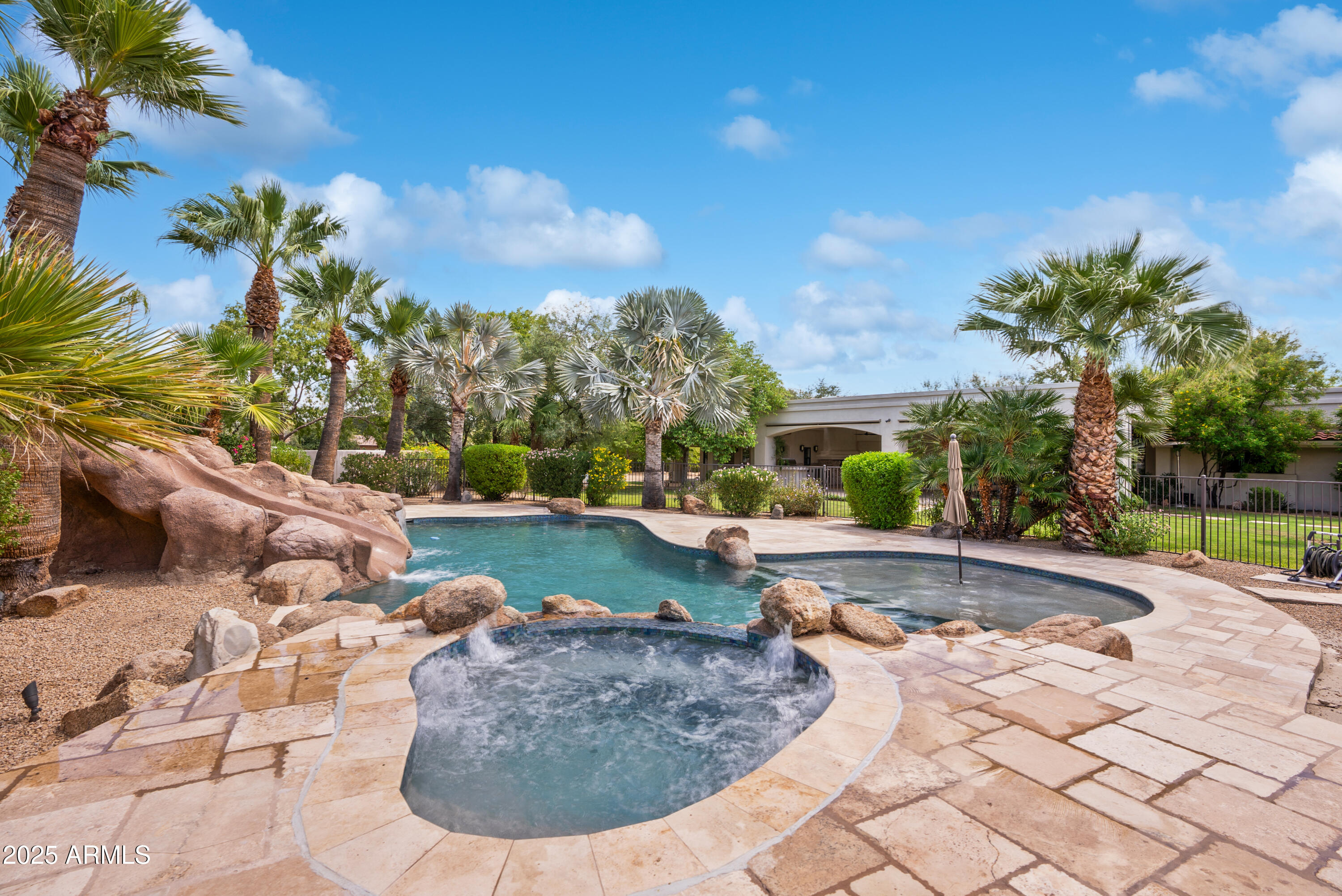 9236 North 52nd Place Paradise Valley, AZ 85253 - Photo 53 of 56 a view of a swimming pool with a patio