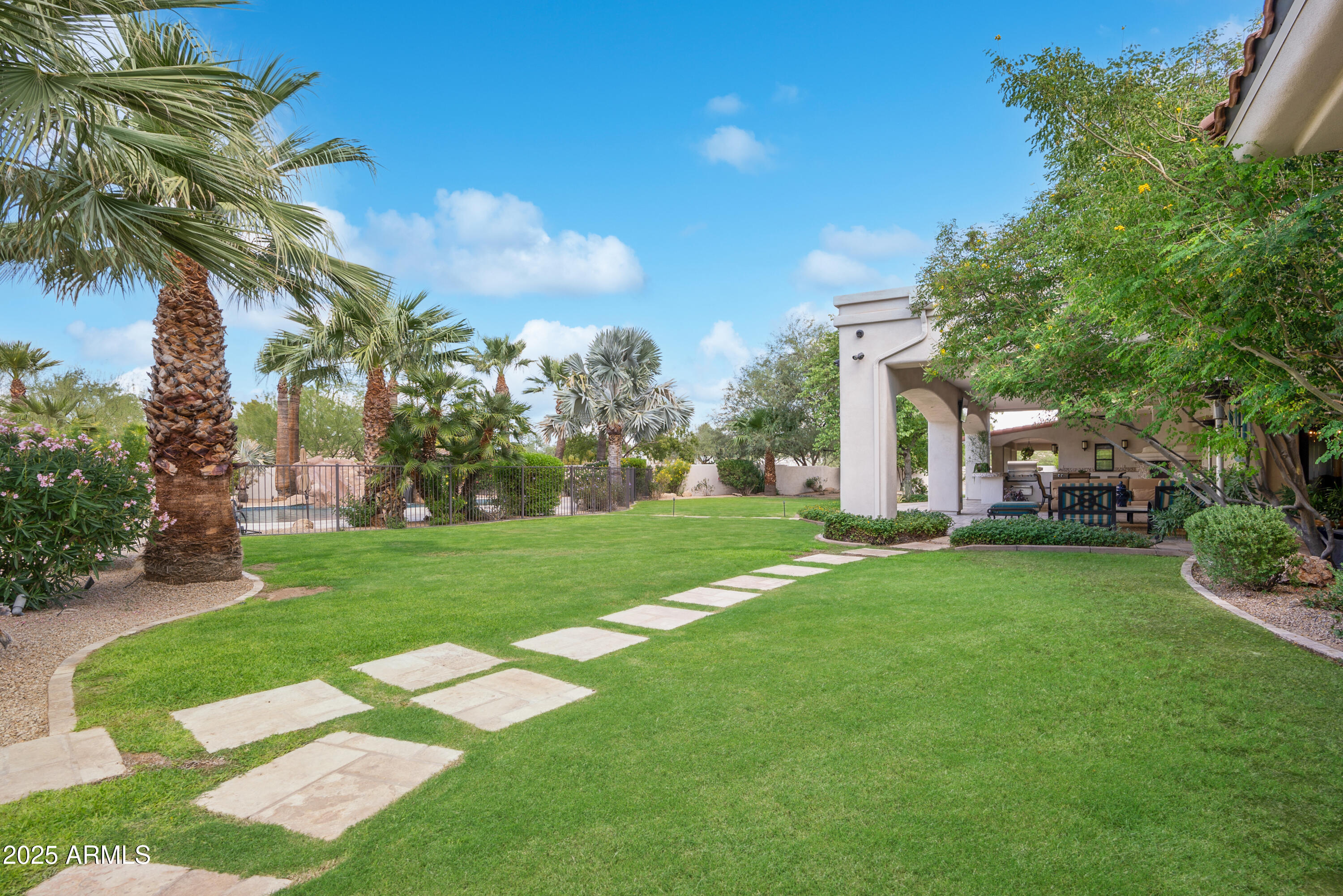 9236 North 52nd Place Paradise Valley, AZ 85253 - Photo 55 of 56 a front view of a house with a yard