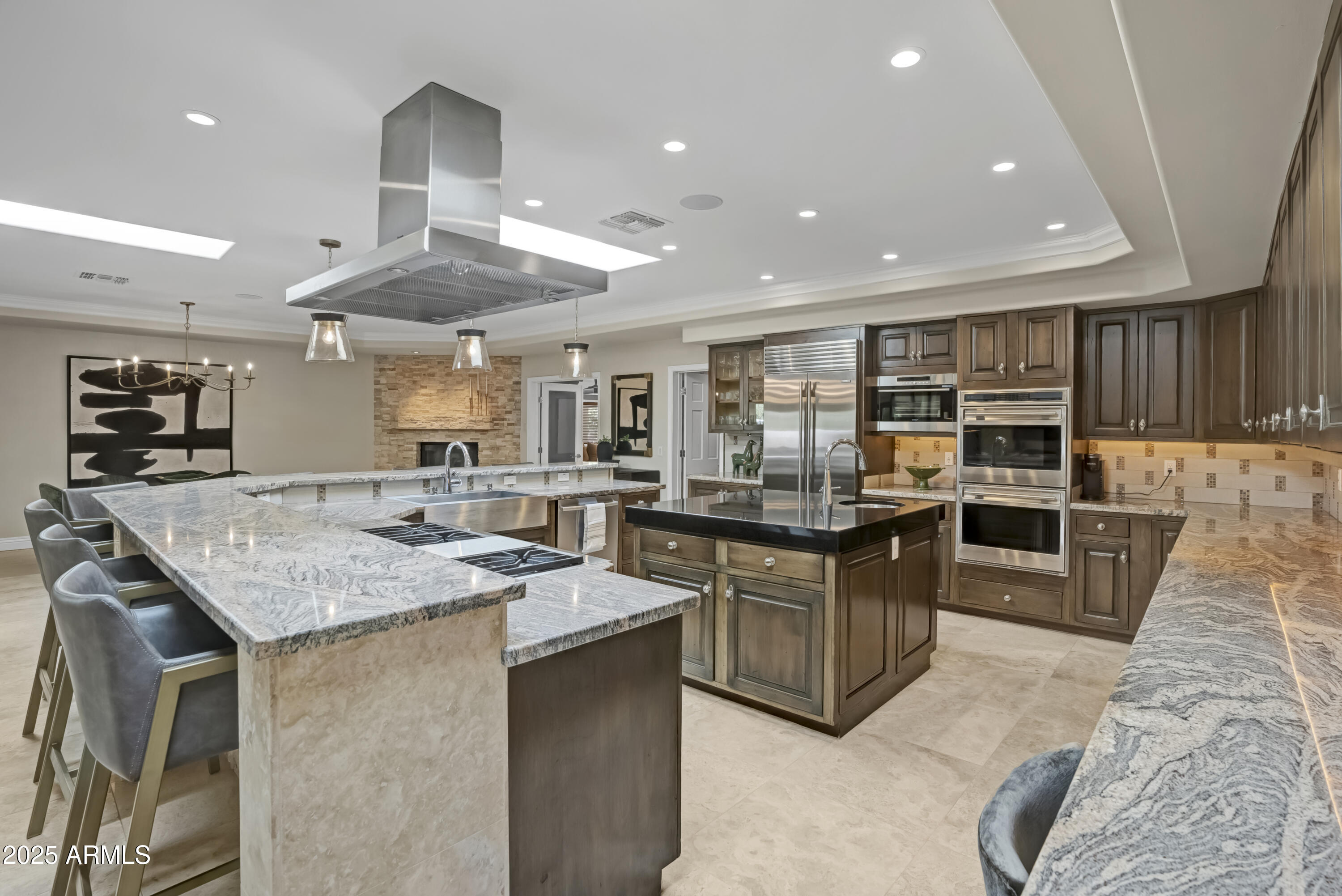 9236 North 52nd Place Paradise Valley, AZ 85253 - Photo 8 of 56 a kitchen with stainless steel appliances granite countertop a stove and a sink