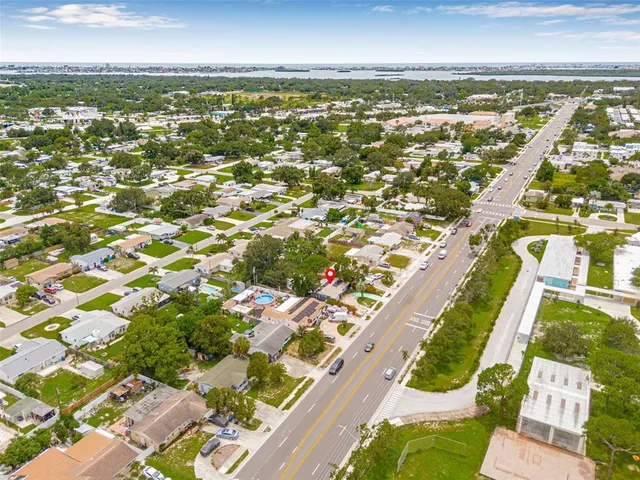 an aerial view of residential building and lake