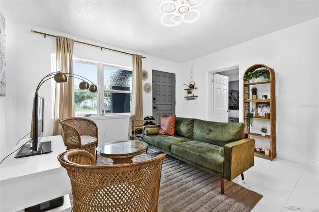 a living room with furniture and a large window