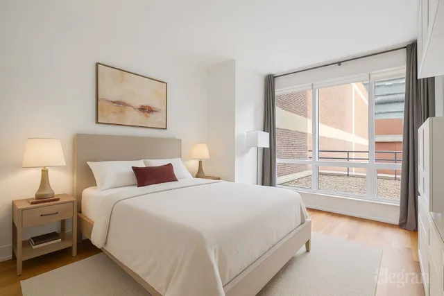 a bathroom with a tub a sink and a mirror