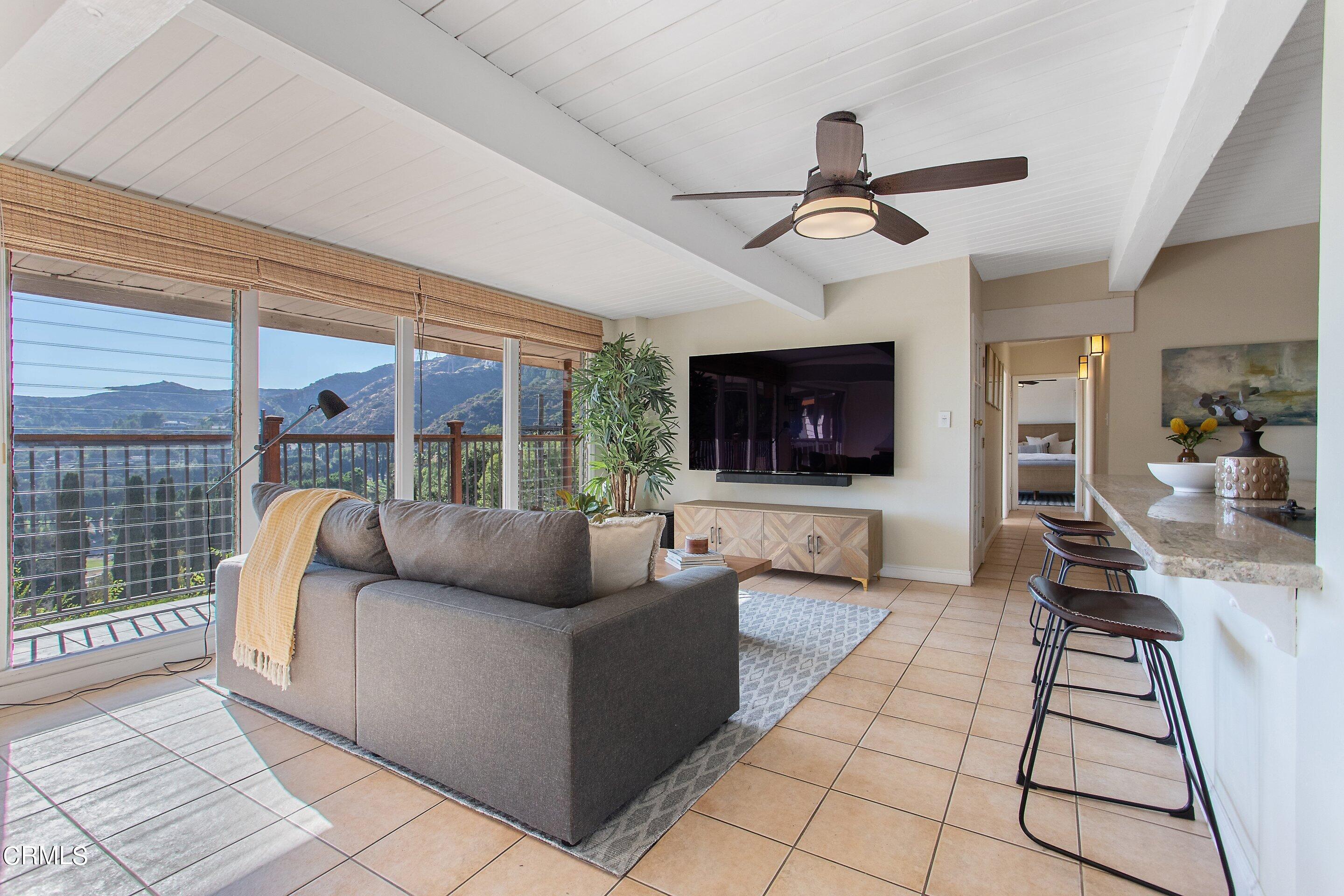 3170 Buckingham Road Glendale, CA 91206 - Photo 12 of 47 a living room with furniture and a flat screen tv