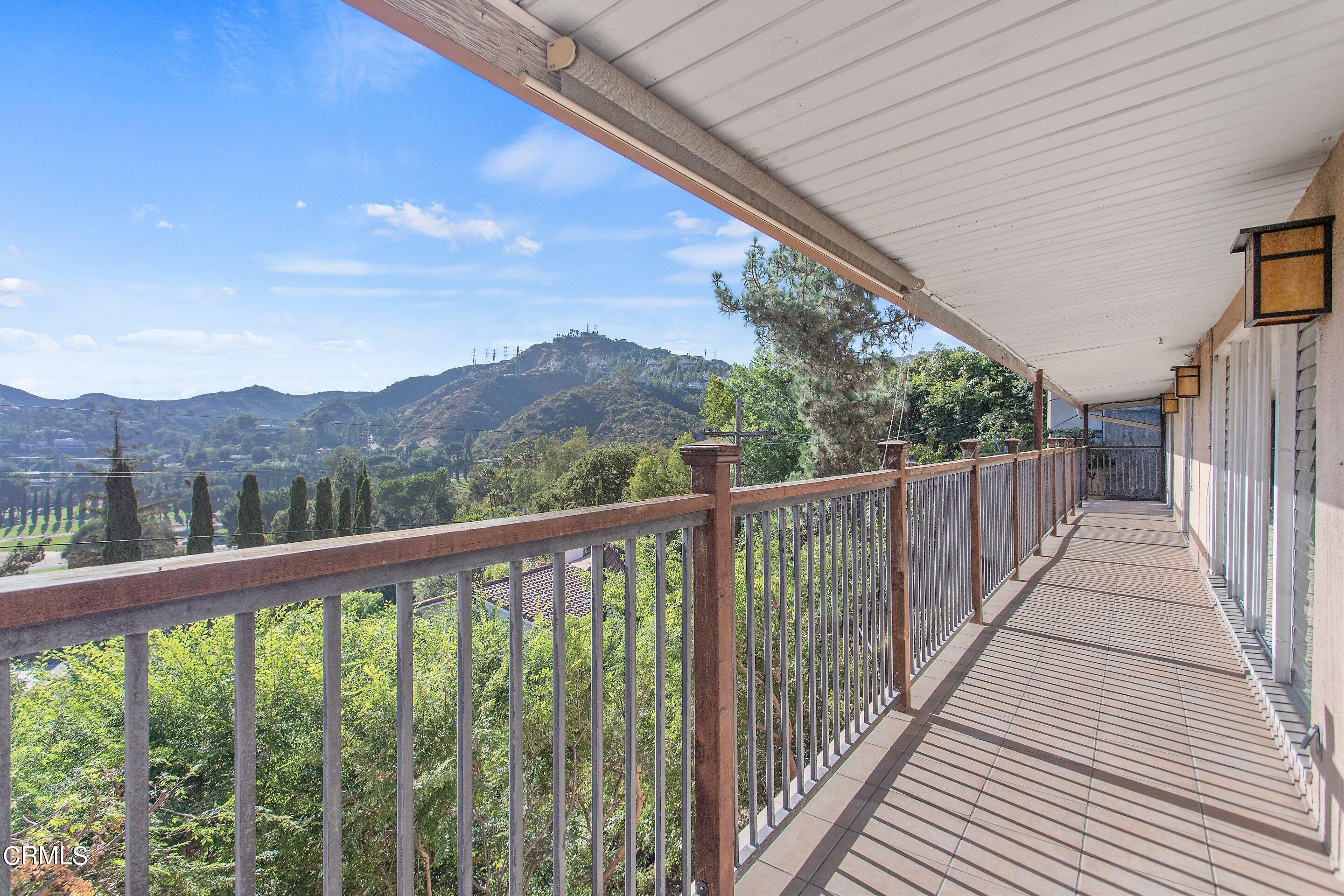 3170 Buckingham Road Glendale, CA 91206 - Photo 14 of 47 a view of a balcony with wooden fence and floor