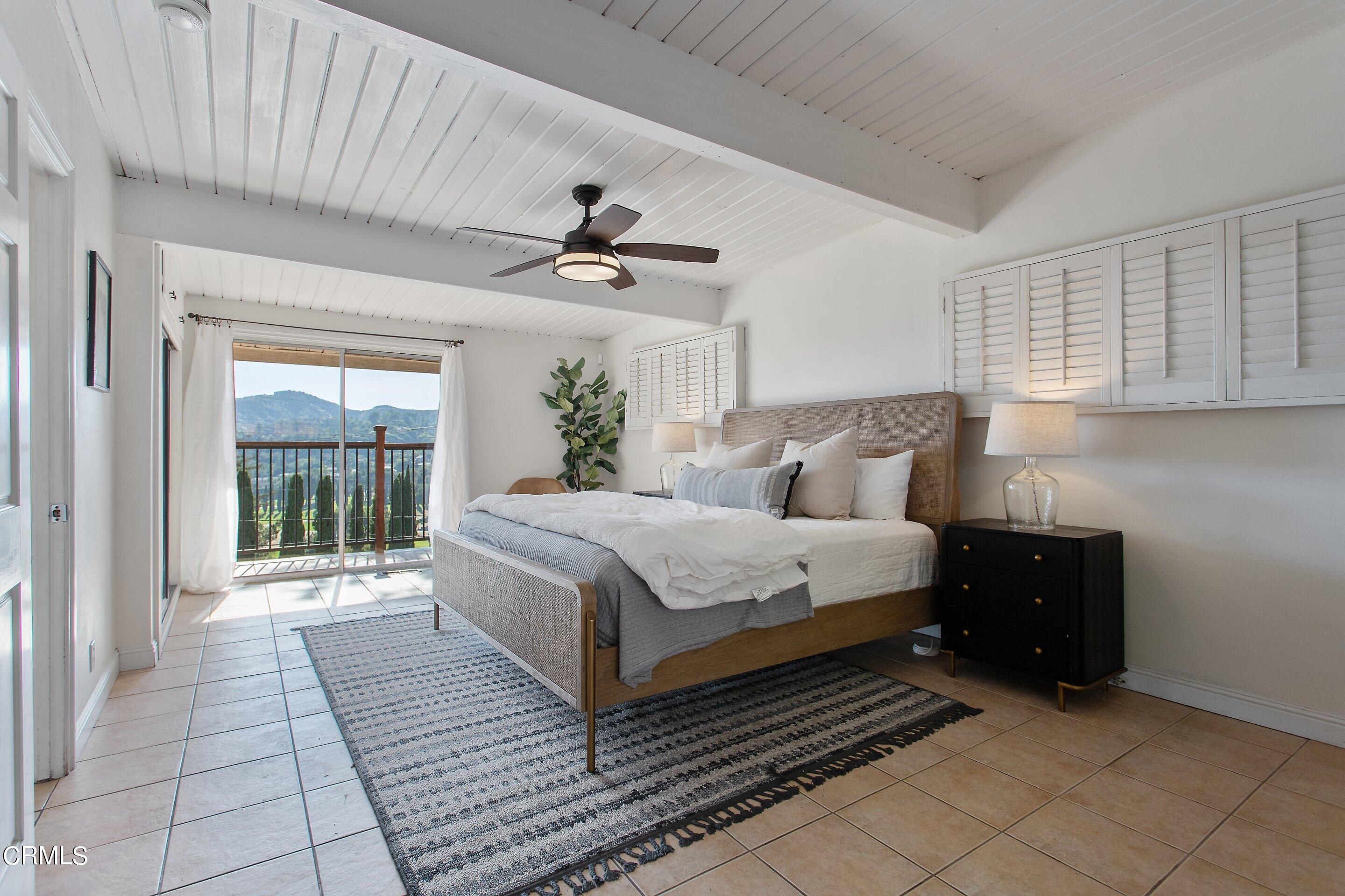 3170 Buckingham Road Glendale, CA 91206 - Photo 15 of 47 a bedroom with a large bed and a window