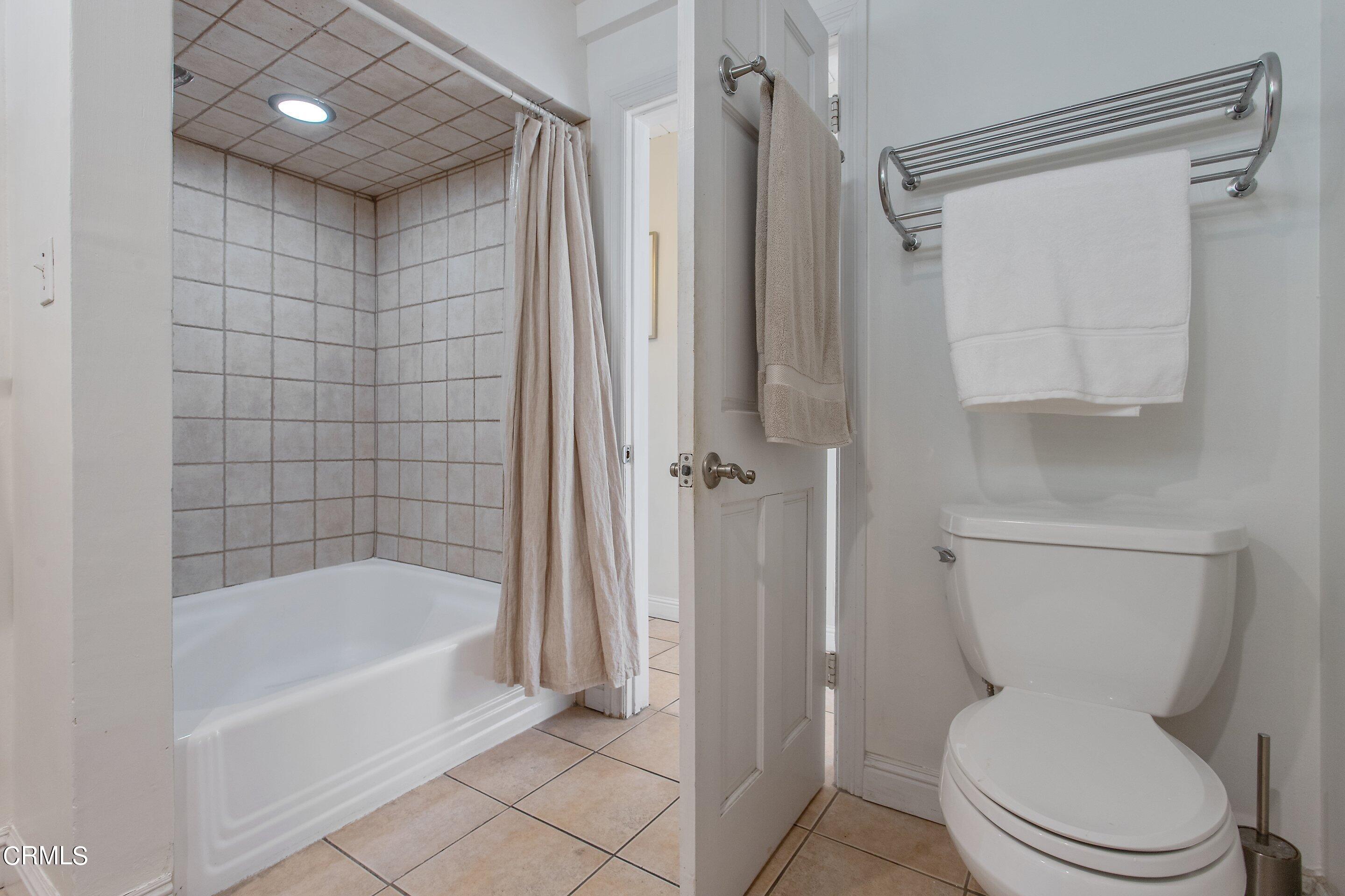 3170 Buckingham Road Glendale, CA 91206 - Photo 17 of 47 a bathroom with a toilet and a shower