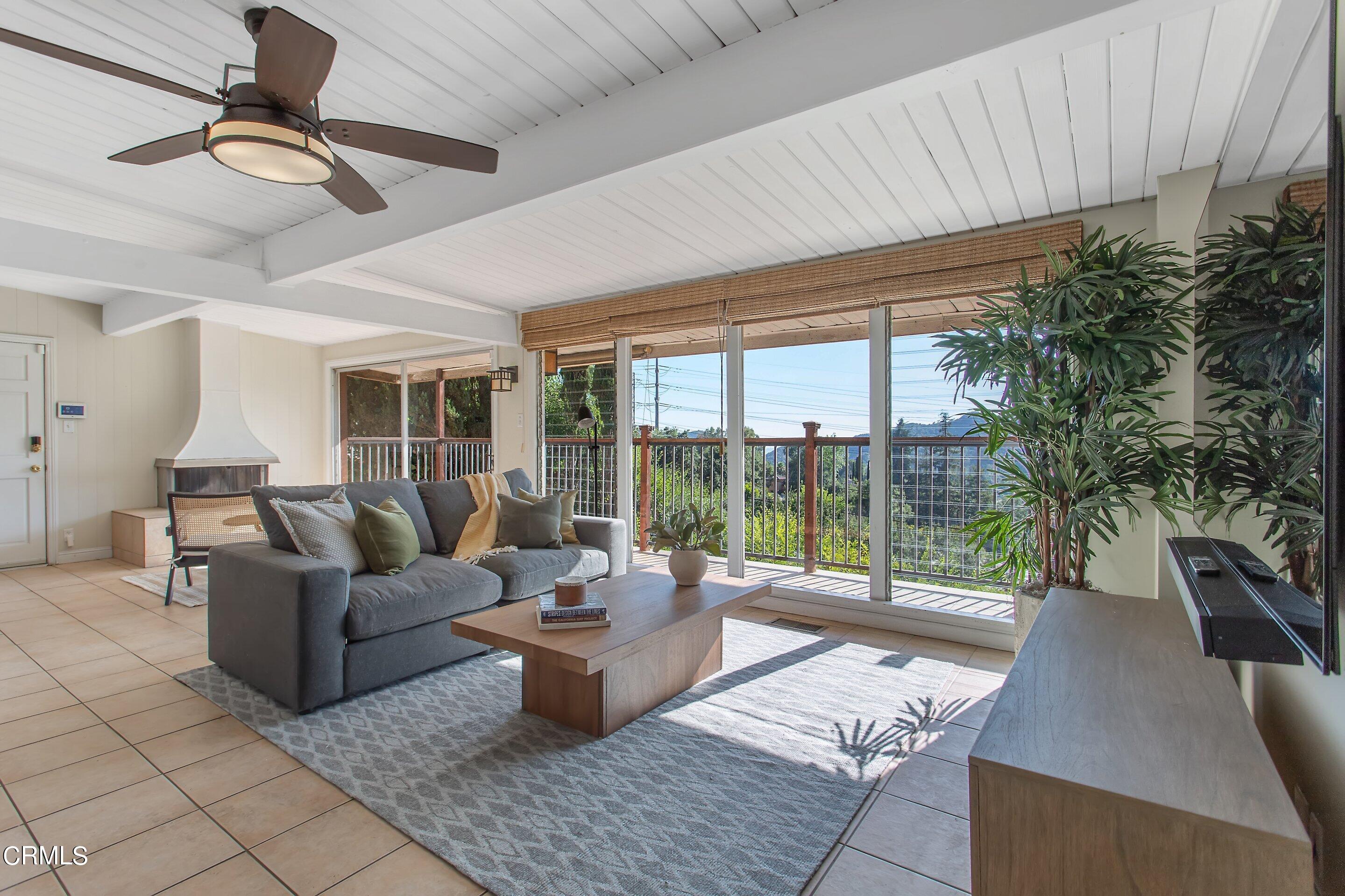 3170 Buckingham Road Glendale, CA 91206 - Photo 2 of 47 a living room with furniture and a floor to ceiling window
